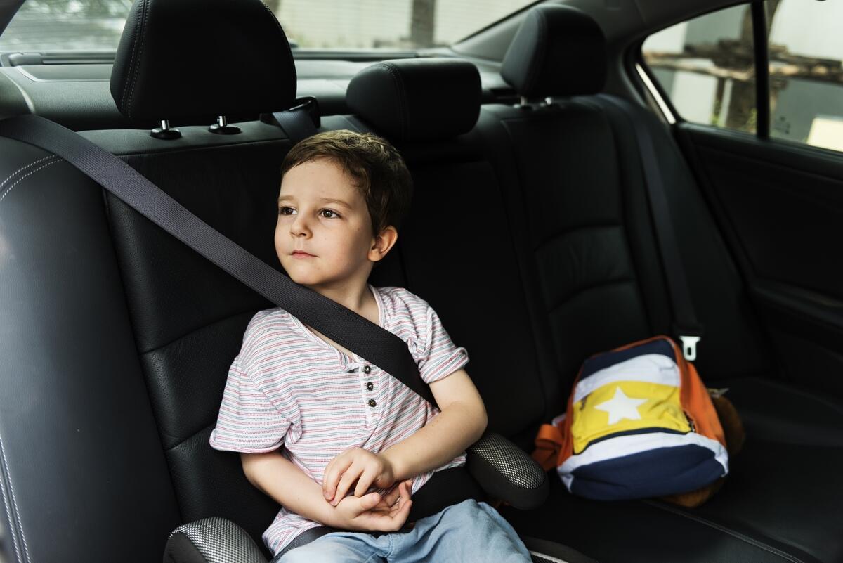 Child in back seat of car